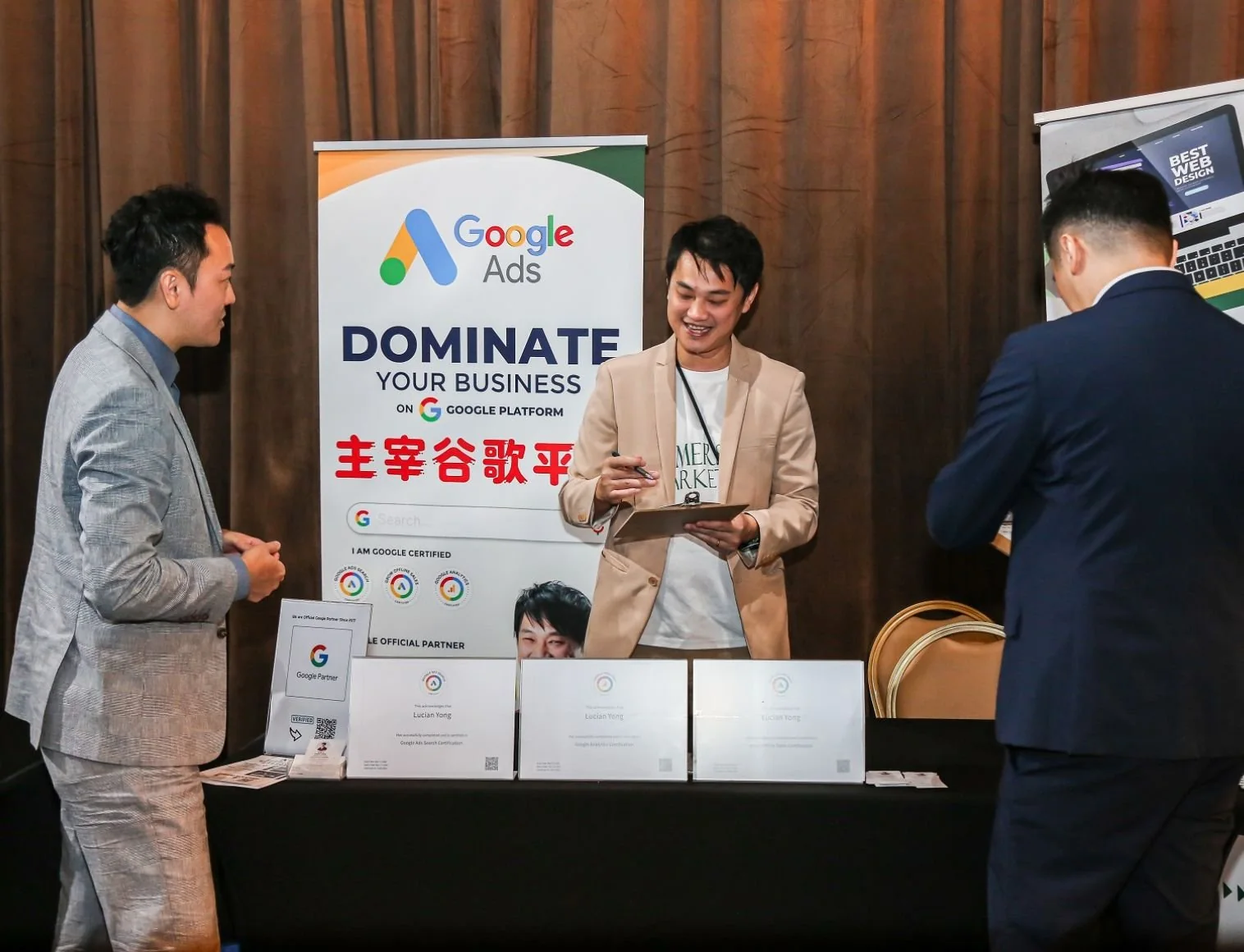 Lucian at his Google Ads booth, talking with business owners